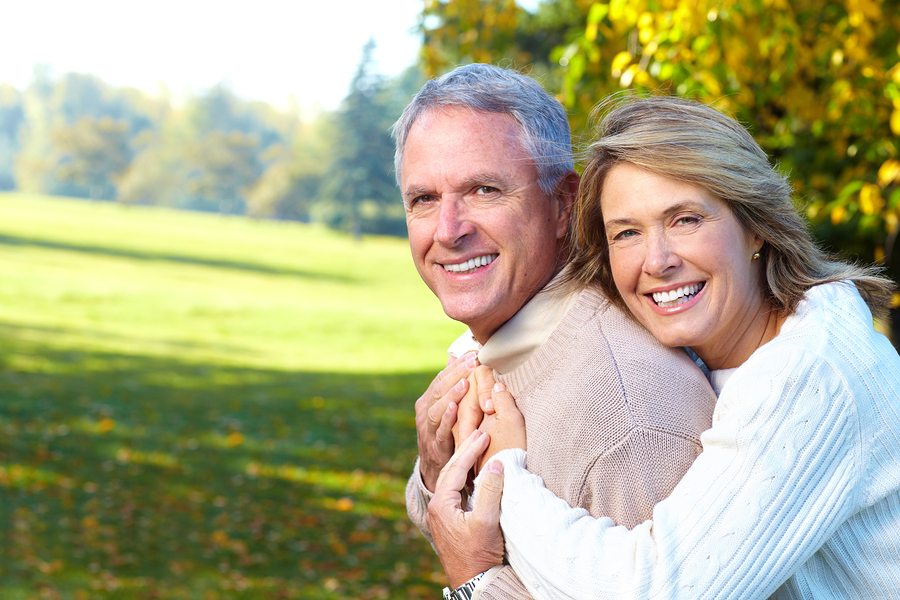 Happy elderly seniors couple in park. Golden age.